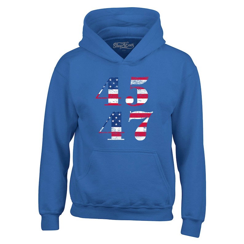 May include: A royal blue hooded sweatshirt with the numbers 45 and 47 printed on the front. The numbers are in a distressed style and are made up of the American flag.