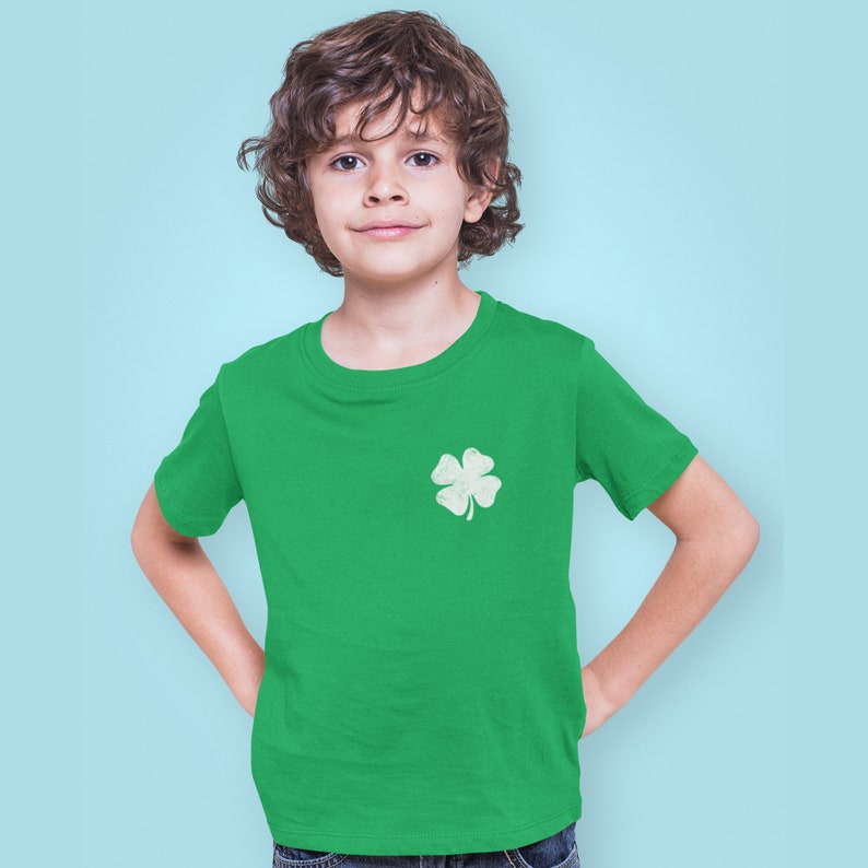 Make St. Patrick’s Day extra special with this Custom Irish Shamrock Kids’ T-Shirt! Personalize it with your child's name and jersey number for a unique and festive look. Perfect for parades, school events, and family celebrations, this customizable Irish Day shirt is a great gift for kids who love to show their Irish pride!