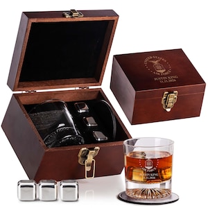 May include: A wooden whiskey gift set with a glass, stainless steel ice cubes, and a coaster. The set includes a personalized wooden box with a latch and the text "UNITED STATES AIR FORCE JUSTIN KING 11.11.2026".