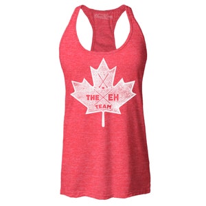 May include: Red tank top with a white distressed graphic of a Canadian maple leaf with hockey sticks crossed inside and the text "THE EH TEAM".
