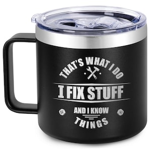 May include: Black stainless steel travel mug with a lid. The mug has a white inscription that reads "That's what I do I fix stuff and I know things".