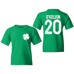 Make St. Patrick’s Day extra special with this Custom Irish Shamrock Kids’ T-Shirt! Personalize it with your child's name and jersey number for a unique and festive look. Perfect for parades, school events, and family celebrations, this customizable Irish Day shirt is a great gift for kids who love to show their Irish pride!
