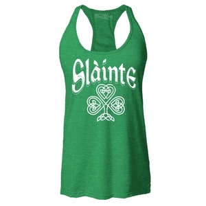 Celebrate St. Patrick’s Day in style with this Sláinte Celtic Knot Racerback Tank Top! Designed with a slim fit for a flattering look, this women's tank features a unique Celtic knot design symbolizing Irish and Scottish heritage. Perfect for pub crawls, parties, and festive celebrations, this Irish gift is a must-have for those who love to raise a toast in style!