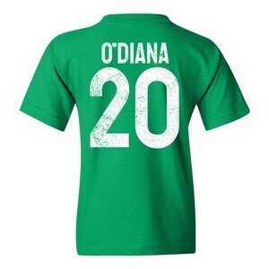 Make St. Patrick’s Day extra special with this Custom Irish Shamrock Kids’ T-Shirt! Personalize it with your child's name and jersey number for a unique and festive look. Perfect for parades, school events, and family celebrations, this customizable Irish Day shirt is a great gift for kids who love to show their Irish pride!