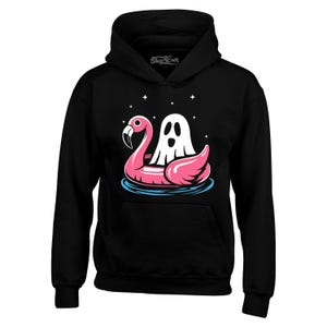 May include: Black hooded sweatshirt featuring a graphic of a white ghost riding a pink flamingo pool float. The flamingo is in blue water with white stars in the background. The text "Shop4Ever" is at the top of the hood.