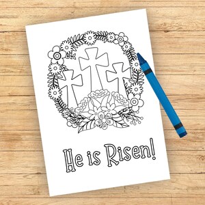 Może przedstawiać: Czarno-biała strona do kolorowania przedstawiająca trzy krzyże otoczone wieńcem kwiat&oacute;w. Pod krzyżami widnieje napis "He is Risen!"