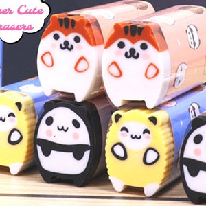 May include: A collection of eight colorful erasers shaped like cute cartoon animals. The erasers are stacked on top of each other and feature panda, tiger, and other animal designs. The erasers are labeled "Super Cute Erasers".