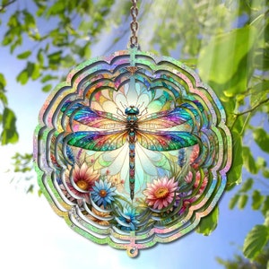 May include: A colorful metal wind spinner with a dragonfly design. The dragonfly has iridescent wings and is surrounded by flowers. The wind spinner is suspended from a chain.