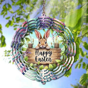 May include: A colorful metal wind spinner with a layered design. The center features a cartoon bunny with the words "Happy Easter" on a wooden sign.