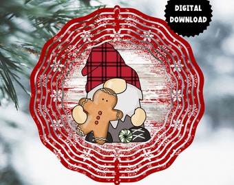 May include: Red and white metal wind spinner with a gnome holding a gingerbread cookie. The gnome is wearing a red and black plaid hat and a white beard. The background is a distressed woodgrain pattern with snowflakes.