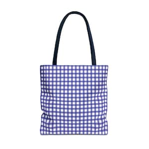 May include: A tote bag with a blue and white gingham pattern. The bag has a rectangular shape with a navy blue handle. The bag is made of a sturdy material and is suitable for carrying groceries, books, or other items.