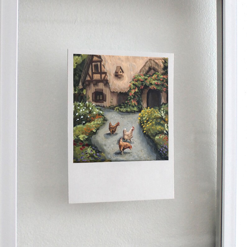 May include: A rectangular art print featuring an oil painting of a cottage with a thatched roof, a stone path, and three chickens in the foreground. The scene includes lush green foliage, colorful flowers, and a birdhouse on the cottage wall.