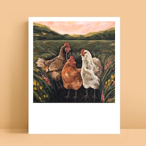 May include: A painting featuring three chickens standing in a grassy field with wildflowers. The chickens are brown, orange, and white, each with a red comb. The background shows rolling green hills under a soft pink and orange sunset sky.