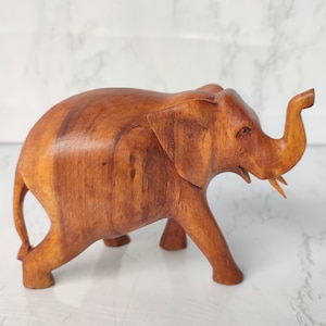 Elephant statue carved from natural wood