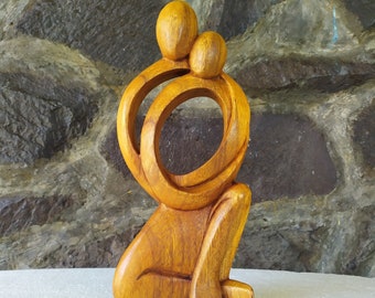 Abstract wooden statue of a loving couple hugging passionately. Dancing Couple Statue. valentines gift.