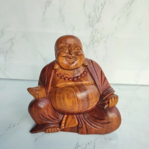 Happy laughing buddha hand carved statue, Happy Buddha “small and medium”. Happy Buddha Wooden Collection. Home decoration statue.