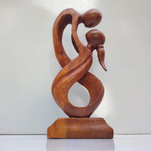 Wooden statue of dancing couple, love statue, romantic statue, wedding statue.