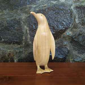 Hand carved penguin statue of natural wood  24 cm