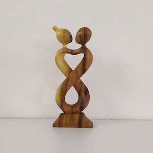 Abstract wooden statue of romantic couple eye to eye. Dancing Couple Statue. valentines gifts for him.