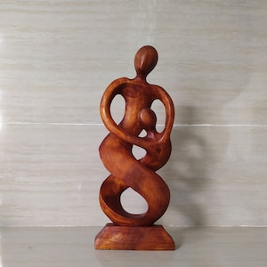 Abstract Statue of Mother and Child Dancing Happily