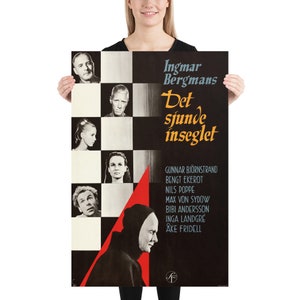 May include: A vintage movie poster for the film "The Seventh Seal" by Ingmar Bergman. The poster features a black and white checkered background with a red triangle in the lower right corner. The title of the film is written in large, bold letters in orange and black. The poster also includes the names of the actors in the film, including Gunnar Bj&ouml;rnstrand, Bengt Ekerot, Nils Poppe, Max von Sydow, Bibi Andersson, Inga Landgr&eacute;, and &Aring;ke Fridell.