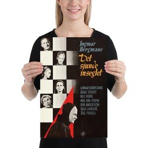 May include: A vintage movie poster for the film "The Seventh Seal" by Ingmar Bergman. The poster features a black and white checkered board with a red triangle in the lower right corner. The triangle contains a hooded figure. The poster also features black and white portraits of the actors in the film, including Max von Sydow, Bibi Andersson, and Gunnar Bj&ouml;rnstrand. The text on the poster reads "Ingmar Bergman's The Seventh Seal" in Swedish.