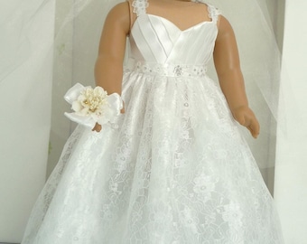 May include: White lace wedding dress with a satin bodice and a beaded belt. The dress has a full skirt and a lace trim. The doll is holding a white flower bouquet.