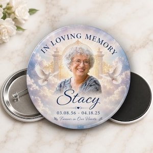 May include: A round memorial button with the text "IN LOVING MEMORY" and a photo of a smiling woman named Stacy. The button includes the dates 03.08.56 - 04.18.25 and the phrase "Forever in Our Hearts."