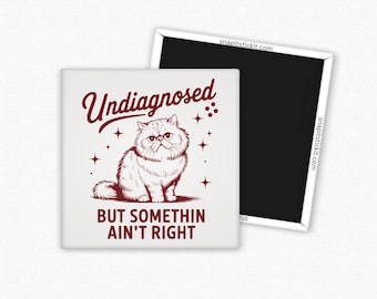 May include: Square white magnet with a maroon illustration of a Persian cat and the text "Undiagnosed BUT SOMETHIN AIN'T RIGHT". The magnet has a black backing and a white border. The website snapitstickit.com is printed on the side.