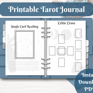 May include: Printable tarot journal with a blue cover and silver rings. The journal has two pages, one for single card readings and one for Celtic cross spreads. Each page has a space for drawing the cards and writing notes.