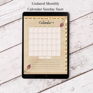 May include: A digital tablet displaying a blank monthly calendar template with a Sunday start. The calendar has a vintage aesthetic with a brown background and a decorative leaf design. The calendar is undated and includes a section for notes.