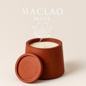 Hand poured soy candle in handmade cement vessel.