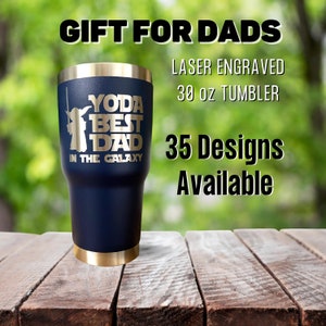 May include: A blue and gold 30 ounce tumbler with a laser engraved design featuring Yoda and the text "Yoda Best Dad in the Galaxy".