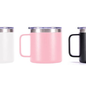 May include: Three stainless steel travel mugs with lids. The mugs are white, pink, and black.