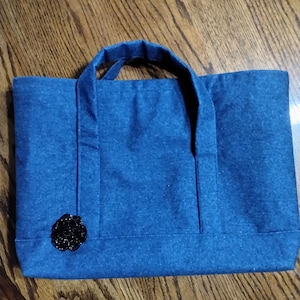 bolso de mano o cartera de mezclilla
