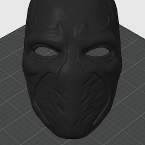 May include: A matte black full-face mask featuring a textured surface with raised, symmetrical brow ridges and a pointed nose bridge. The mask has two almond-shaped eye openings and a distinct, organic, vein-like pattern across the entire front.