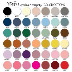 May include: A colour chart from Timber Creative + Company, showcasing a variety of colour options. The chart includes a range of hues, from black and white to vibrant shades like Barbie pink and red. Each colour is displayed in a circular swatch with its name.