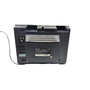 May include: A black Emerson television set, viewed from the back. The television has a rectangular shape with a dark grey finish. The back features ventilation slots and a label with model information.