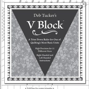 May include: A black and white ruler with the text "Deb Tucker's V Block" and "A Trim Down Ruler for One of Quilting's Most Basic Units". The ruler has markings for cutting strips of fabric in different sizes, from 1 inch to 6 inches.