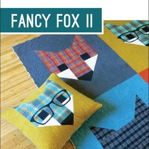May include: A quilt and pillow pattern featuring a fox design with glasses. The pattern is titled "Fancy Fox II" and is by Elizabeth Hartman.