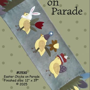 May include: A gray Easter-themed banner with appliqued yellow chicks, each adorned with a hat or bunny ears. The banner is 12 inches by 37 inches and features the text "Easter Chicks on Parade."