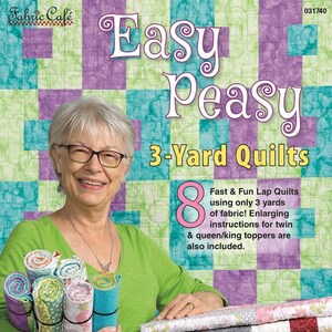 May include: A woman smiles while holding rolls of fabric and a stack of quilts. The book cover reads "Easy Peasy 3-Yard Quilts" with the text "8 Fast & Fun Lap Quilts using only 3 yards of fabric! Enlarging instructions for twin & queen/king toppers are also included." The book is by Donna Robertson.