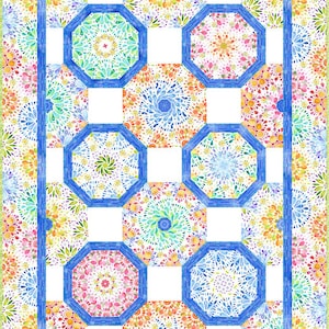 May include: A colorful quilt with a geometric pattern of octagons and squares. The octagons are filled with a watercolor design of blue, green, yellow, orange, and pink. The squares are white. The quilt is surrounded by a border of blue and yellow.
