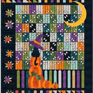 May include: A Halloween-themed quilt featuring a black cat wearing a witch hat atop stacked pumpkins. The quilt has a colorful patchwork design with stars, a crescent moon, and a fence. The color palette includes orange, purple, green, and black.