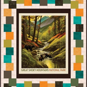 May include: A quilt featuring a central image of a stream in the Great Smoky Mountains National Park with bears. The image is framed by a brown border and surrounded by a patchwork design of squares in various colors, including teal, orange, and green.