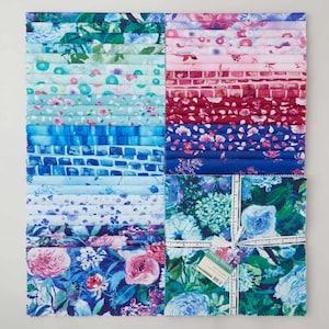 May include: A stack of fabric squares featuring a variety of floral and geometric patterns in shades of blue, teal, pink, and magenta. The collection is tied with a white ribbon and includes a tag labeled Peony Bloom with 42 squares.