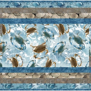 May include: A blue and brown table runner with a pattern of crabs and seashells. The runner has a geometric design with a blue border and a brown inner border.