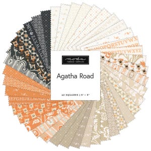 May include: A circular arrangement of 42 fabric squares, each 5" x 5", in various patterns and colors. The color palette includes shades of black, orange, cream, and tan. The center features a white square with the text "Agatha Road".