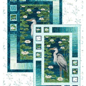 May include: Two quilts with a water lily and heron design. The quilts feature a teal and blue color scheme with white water lilies and a gray heron. The word "Harmony" is written at the top. The Sweet Tea Girls Patterns logo is at the bottom.