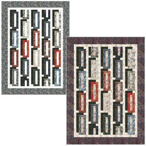 May include: Two quilt patterns with a geometric design featuring black, white, gray, red, and blue squares and rectangles. The patterns are framed with a border.